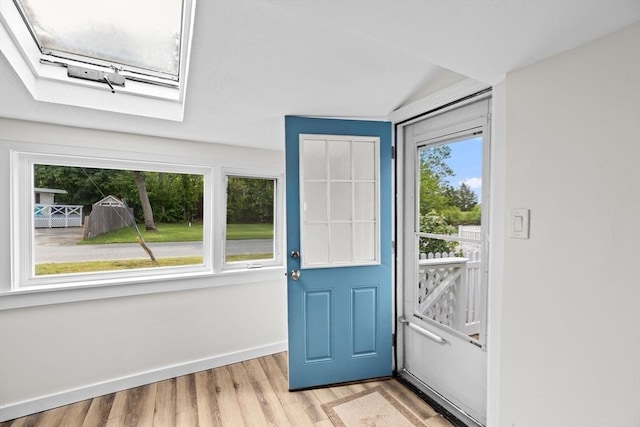 216 Waltham St, Hanson, MA 02341 - foyer with a skylight, light wood-style flooring, and baseboards