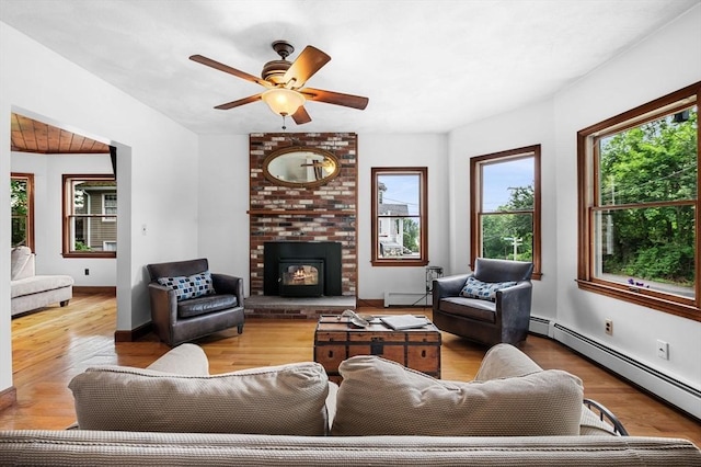31 Cedar Hill Ter, Swampscott, MA 01907 - living room with healthy amount of natural light, a baseboard heating unit, and wood finished floors