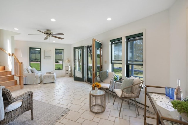 living room with stairway, ceiling fan, and recessed lighting