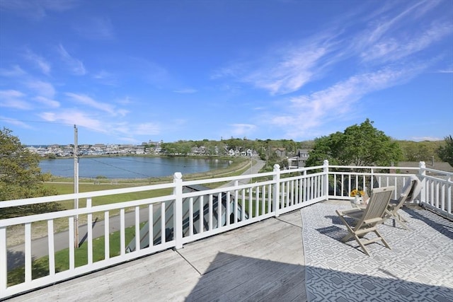 deck featuring a water view