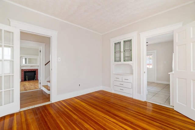204 Maple St, Boston, MA 02132 - unfurnished room with stairs, crown molding, and tile patterned flooring
