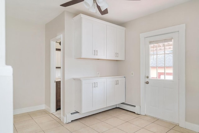 204 Maple St, Boston, MA 02132 - laundry area featuring a ceiling fan, a baseboard heating unit, and light tile patterned floors