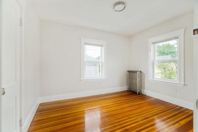 204 Maple St, Boston, MA 02132 - unfurnished room with radiator heating unit and wood-type flooring