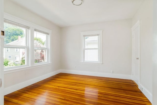 204 Maple St, Boston, MA 02132 - empty room featuring plenty of natural light and wood finished floors
