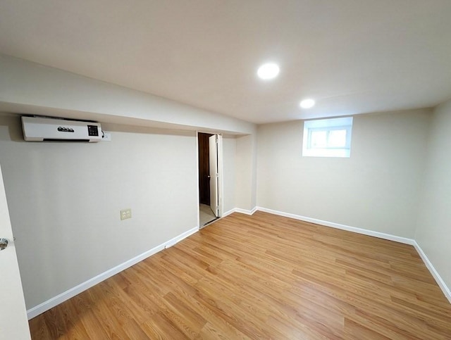 204 Maple St, Boston, MA 02132 - basement with an AC wall unit, light wood-type flooring, and recessed lighting