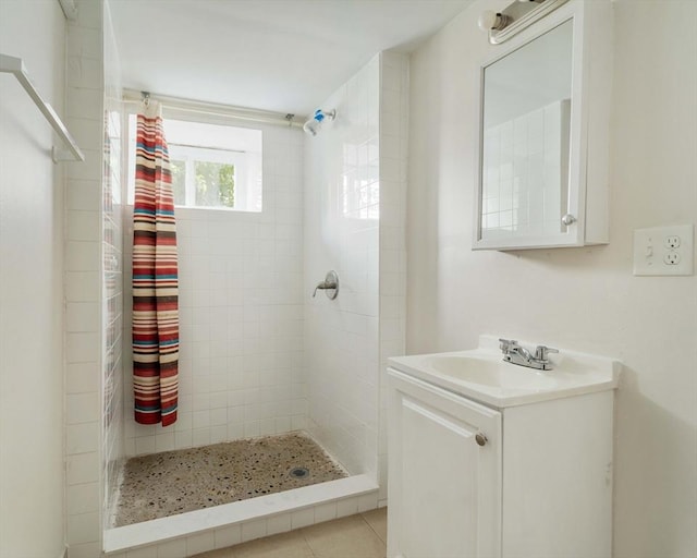 204 Maple St, Boston, MA 02132 - bathroom featuring tiled shower, vanity, and tile patterned floors