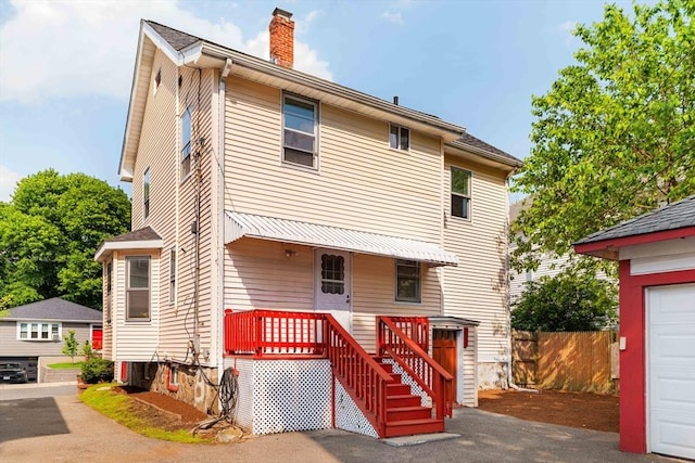 204 Maple St, Boston, MA 02132 - view of front of home featuring a chimney and a porch