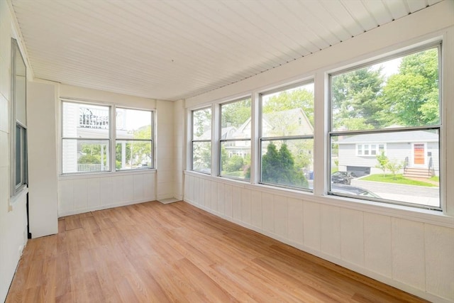 204 Maple St, Boston, MA 02132 - unfurnished sunroom featuring wood finished floors and a wooden deck
