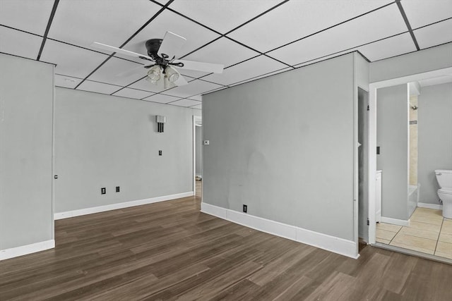 empty room featuring ceiling fan and dark hardwood / wood-style floors