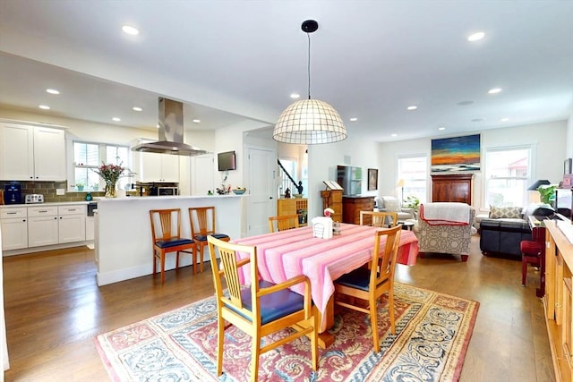 12 Lester Ter, Somerville, MA 02144 - dining area with wood finished floors, stairway, and recessed lighting