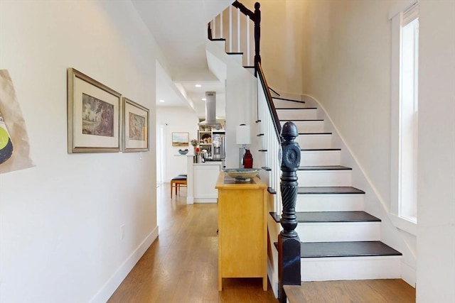 12 Lester Ter, Somerville, MA 02144 - stairs featuring wood finished floors, baseboards, and recessed lighting