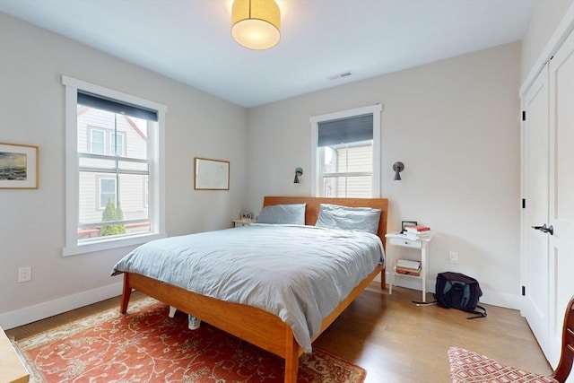 12 Lester Ter, Somerville, MA 02144 - bedroom with light wood-type flooring and baseboards