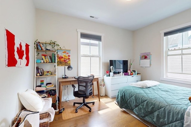 12 Lester Ter, Somerville, MA 02144 - bedroom featuring light wood-style floors and a desk