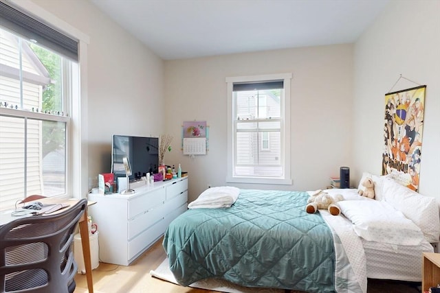 12 Lester Ter, Somerville, MA 02144 - bedroom with multiple windows and light wood finished floors