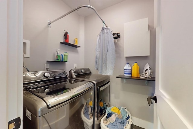 12 Lester Ter, Somerville, MA 02144 - washroom with washing machine and clothes dryer and baseboards