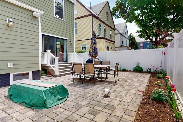 12 Lester Ter, Somerville, MA 02144 - fenced backyard featuring a patio and outdoor dining area