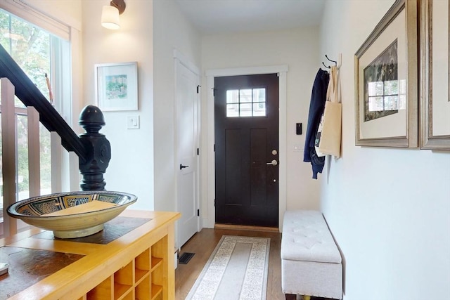 12 Lester Ter, Somerville, MA 02144 - entryway featuring wood finished floors, plenty of natural light, and stairs