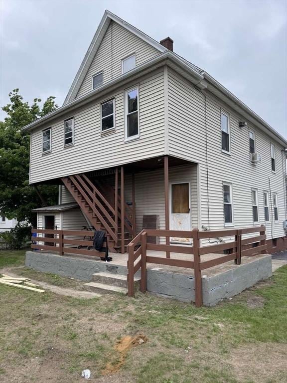 5 Rogers Ave, Springfield, MA 01151 - rear view of house featuring a chimney and stairway