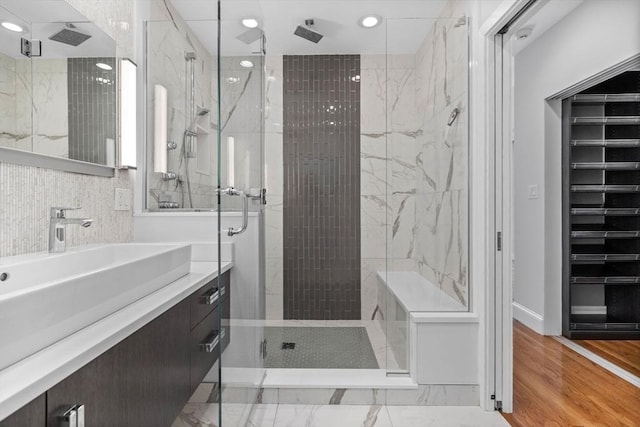 316 Beacon St Unit 1, Boston, MA 02116 - bathroom featuring a marble finish shower, vanity, recessed lighting, and wine cooler