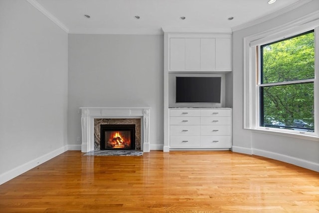 316 Beacon St Unit 1, Boston, MA 02116 - unfurnished living room with ornamental molding, healthy amount of natural light, a fireplace, light wood-style floors, and recessed lighting