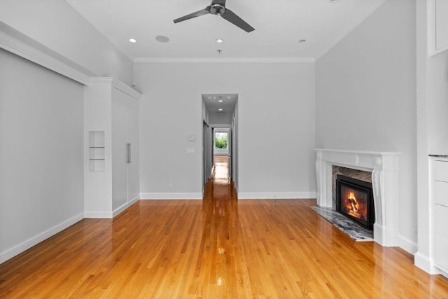 316 Beacon St Unit 1, Boston, MA 02116 - unfurnished living room with ceiling fan, a fireplace, light wood-style floors, and crown molding