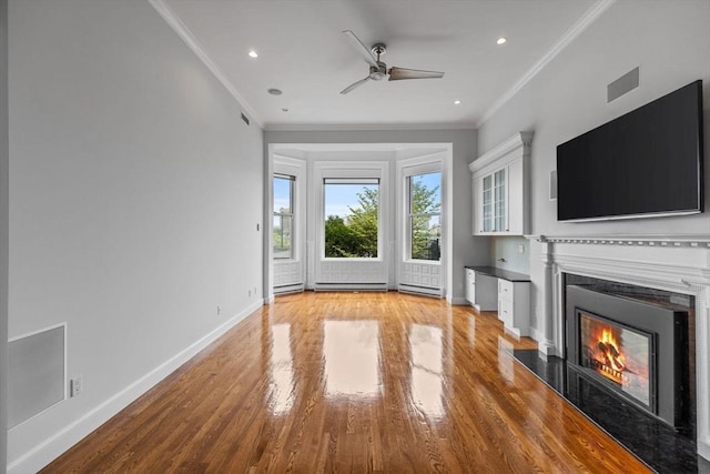 316 Beacon St Unit 1, Boston, MA 02116 - unfurnished living room with a lit fireplace, light wood-type flooring, ceiling fan, ornamental molding, and recessed lighting