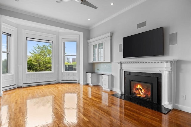316 Beacon St Unit 1, Boston, MA 02116 - unfurnished living room featuring a ceiling fan, ornamental molding, wood finished floors, a baseboard heating unit, and a premium fireplace