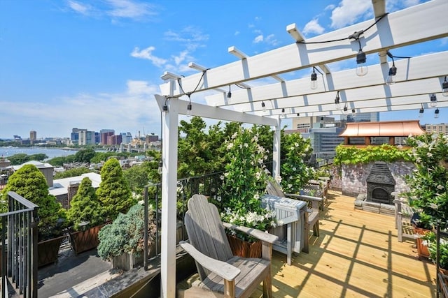 view of patio featuring an outdoor brick fireplace and a pergola