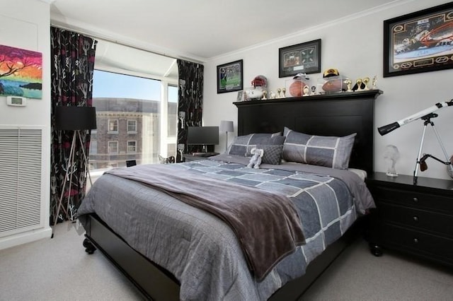 carpeted bedroom with ornamental molding