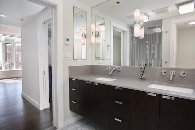 bathroom featuring hardwood / wood-style flooring and vanity