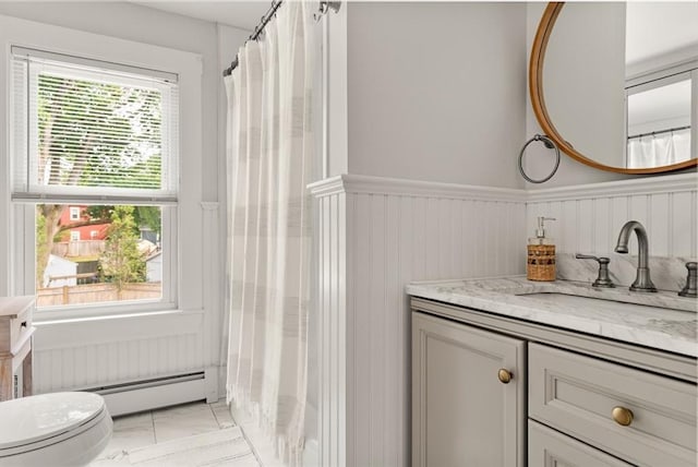 59-61 Elm St, Andover, MA 01810 - full bathroom featuring vanity, a wainscoted wall, a baseboard radiator, and a shower with shower curtain
