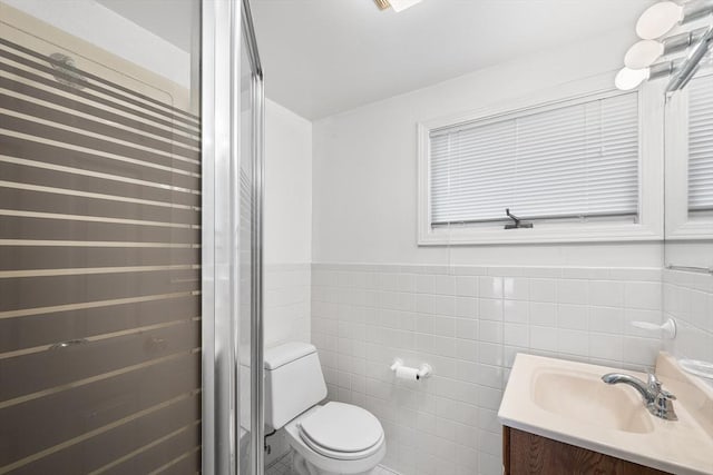 20 Hilltop Dr, Burlington, MA 01803 - bathroom featuring vanity, tile walls, a shower stall, and wainscoting
