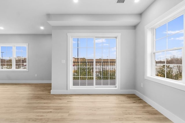 unfurnished room featuring light wood-type flooring