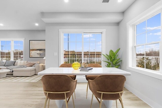 dining room with light hardwood / wood-style flooring