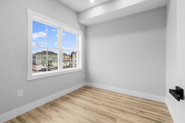 unfurnished room featuring light wood-type flooring