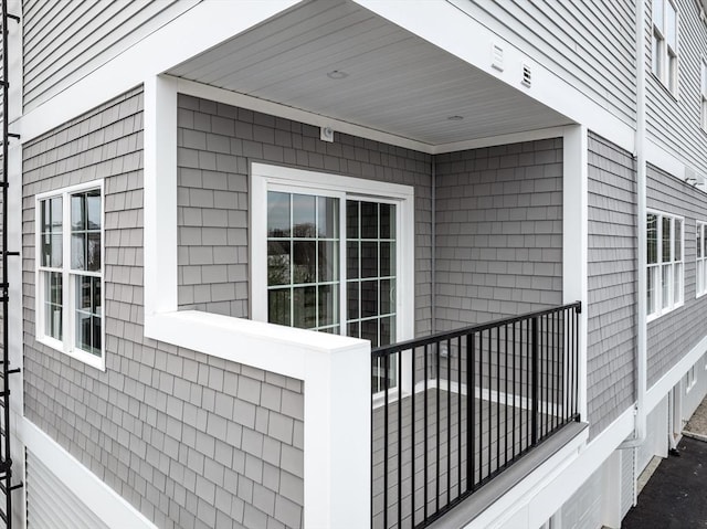 view of side of home featuring a balcony