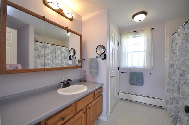 full bathroom with a shower with shower curtain, tile patterned floors, baseboard heating, and vanity