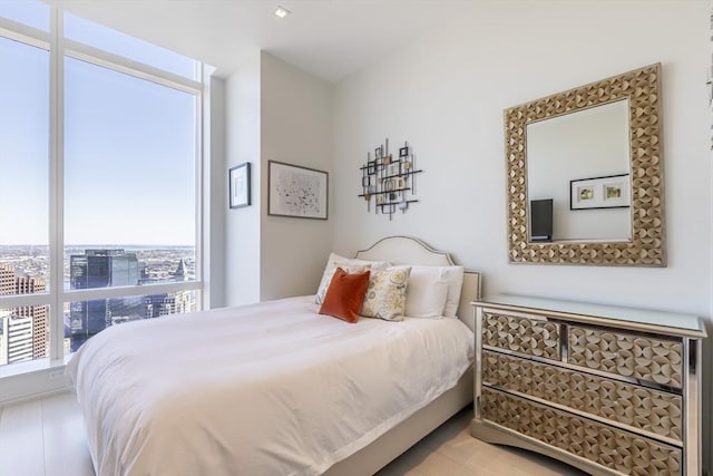 bedroom featuring a city view