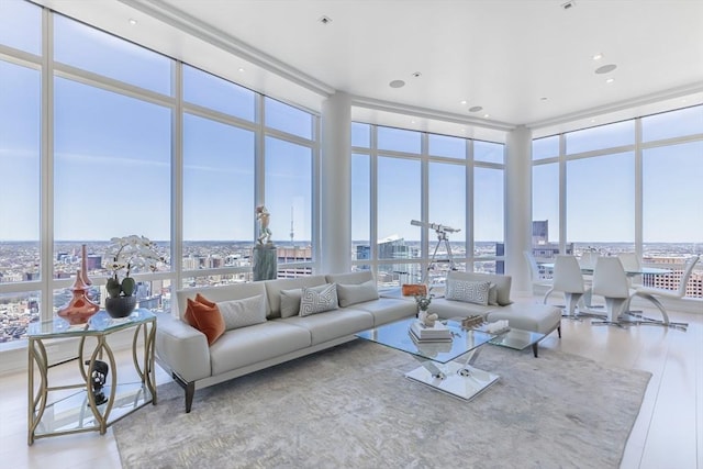 living area with floor to ceiling windows and a view of city