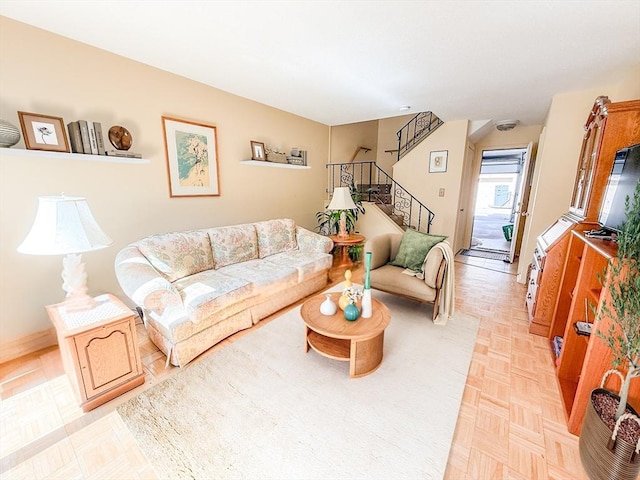 living room featuring stairway