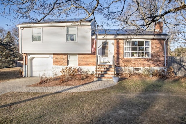 split level home with a garage