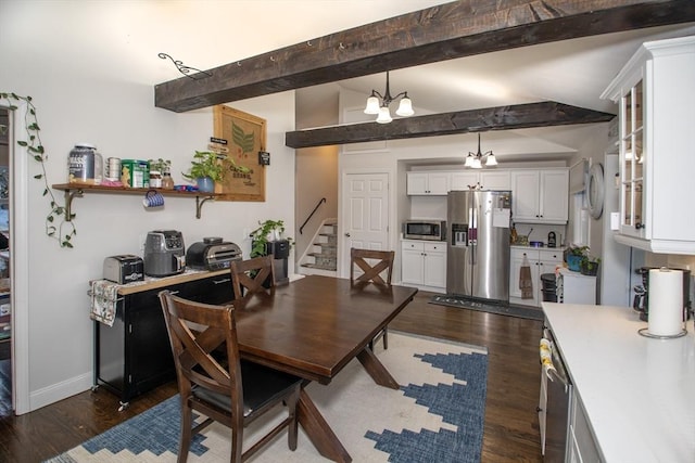 dining area with beam ceiling, a chandelier, and dark hardwood / wood-style flooring