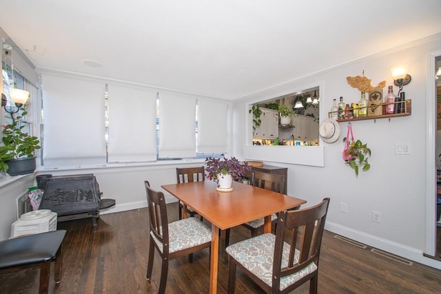 dining room featuring dark hardwood / wood-style flooring