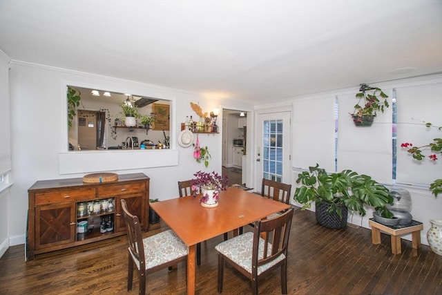 dining space featuring dark hardwood / wood-style floors