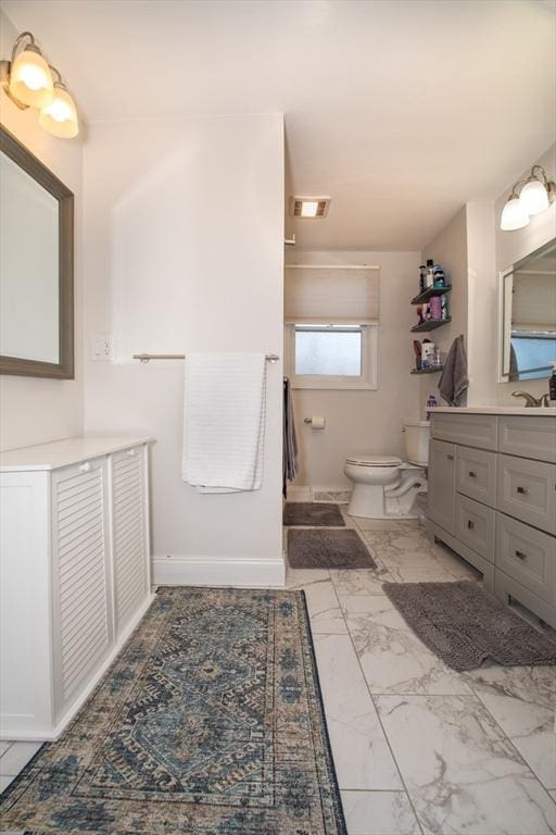 bathroom with vanity and toilet