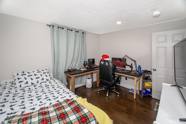 bedroom featuring dark wood-type flooring