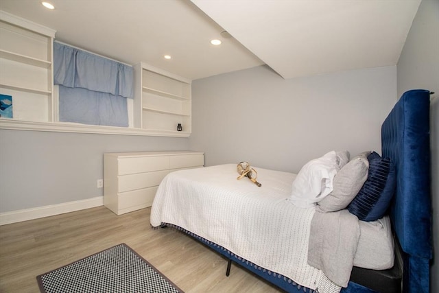 bedroom with light wood-type flooring