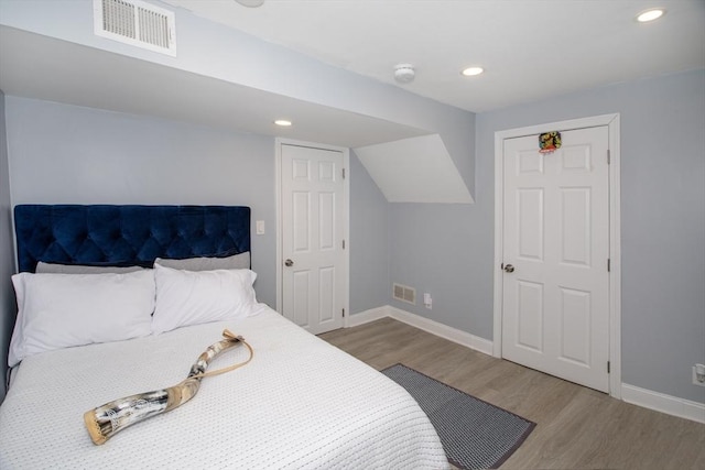 bedroom with light hardwood / wood-style floors