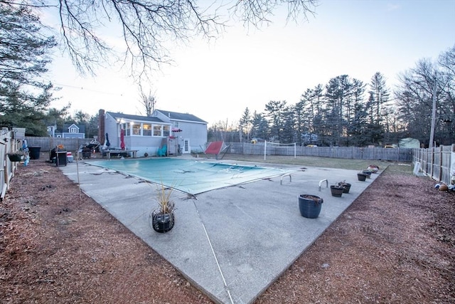 view of swimming pool featuring a patio area