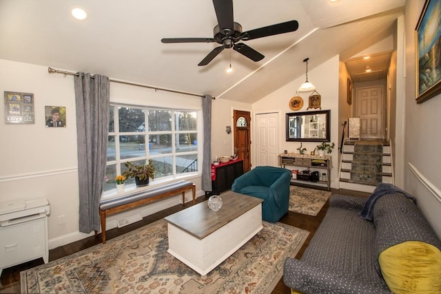 living room featuring dark hardwood / wood-style flooring, vaulted ceiling, and ceiling fan